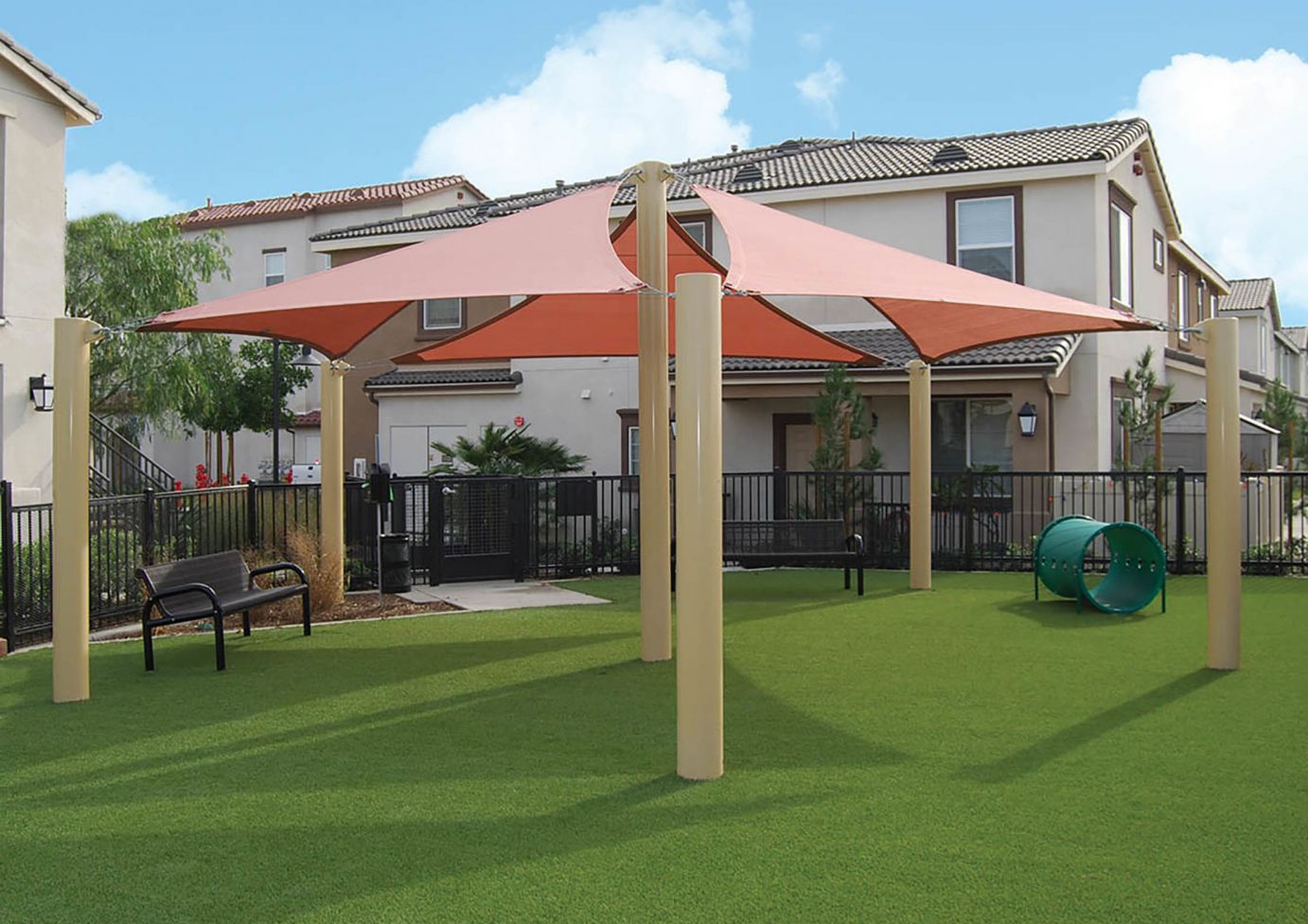 Residential playground with canopy and bench