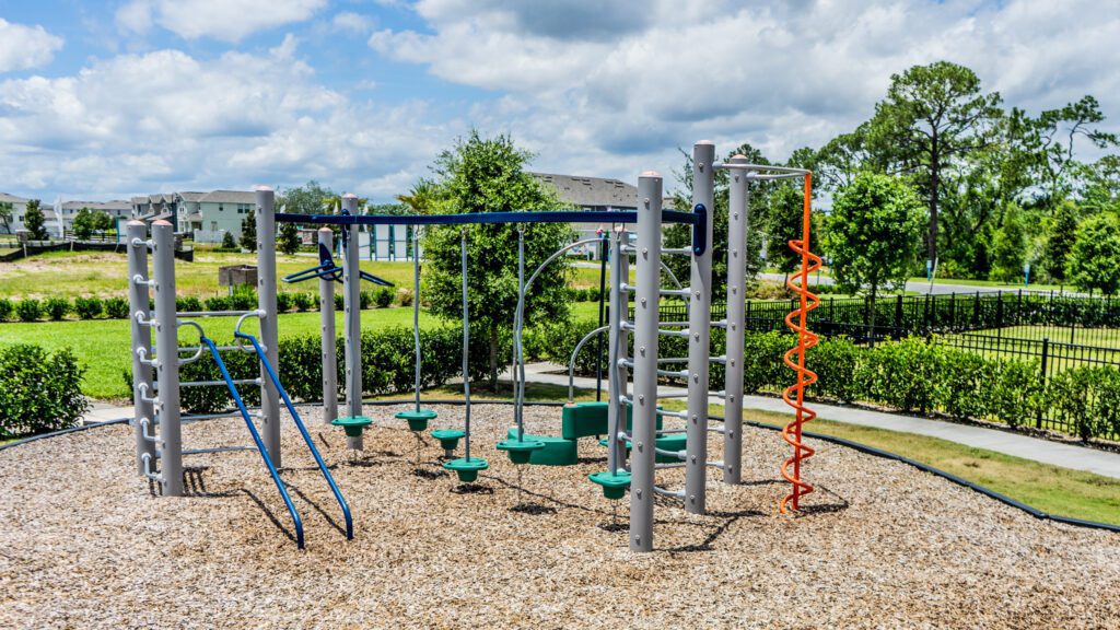 Playground equipment with climbing and sliding structures.
