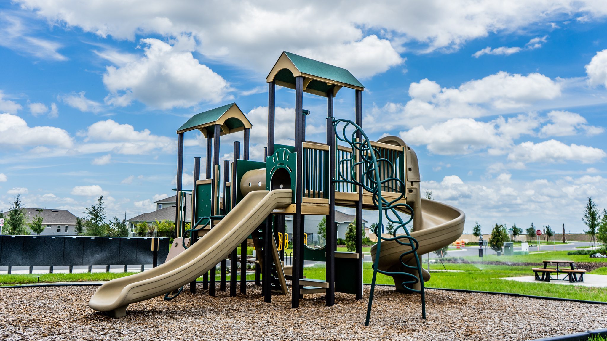 Outdoor play area with climbing structures