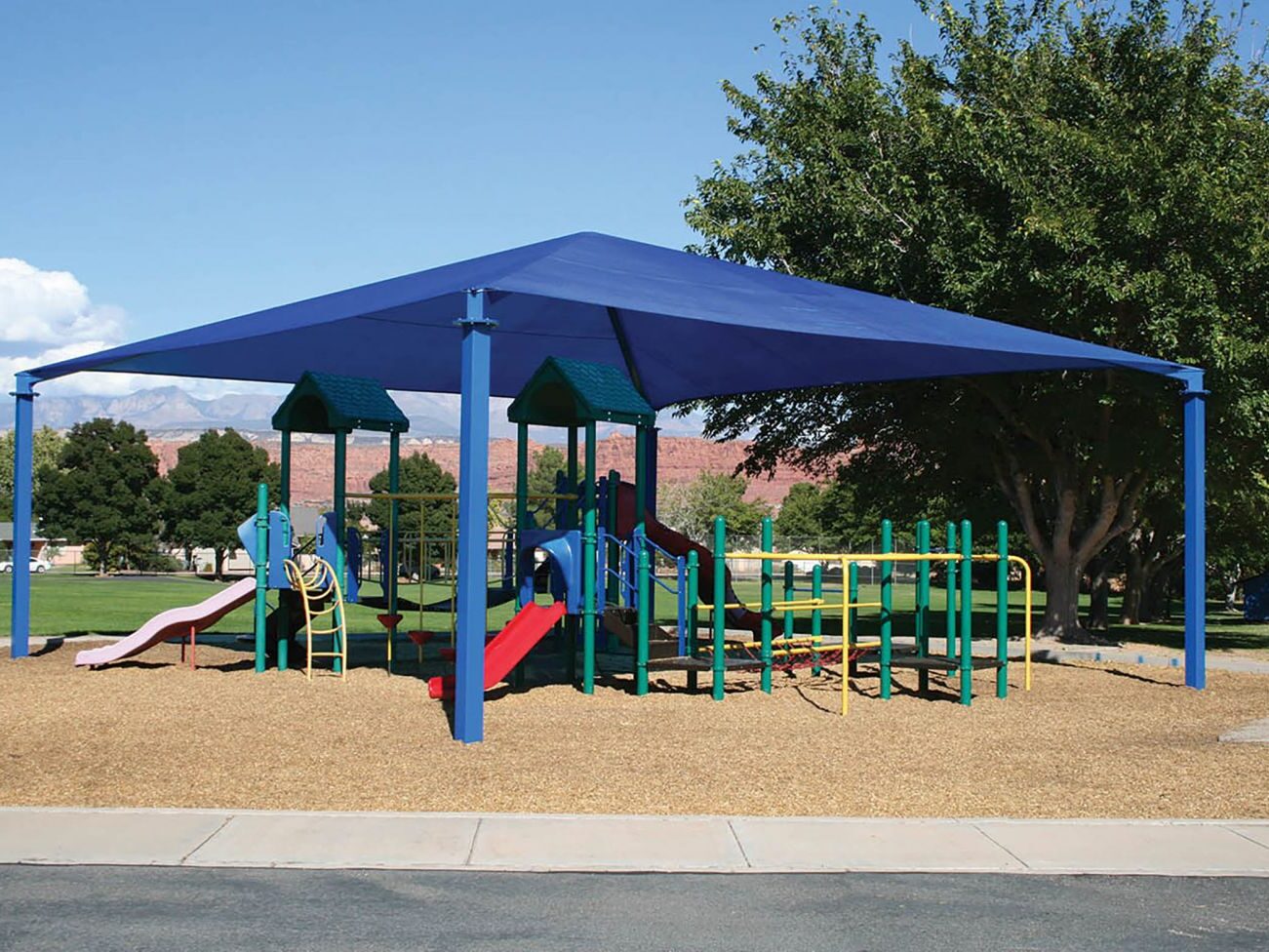 Colorful playground equipment under sunshade