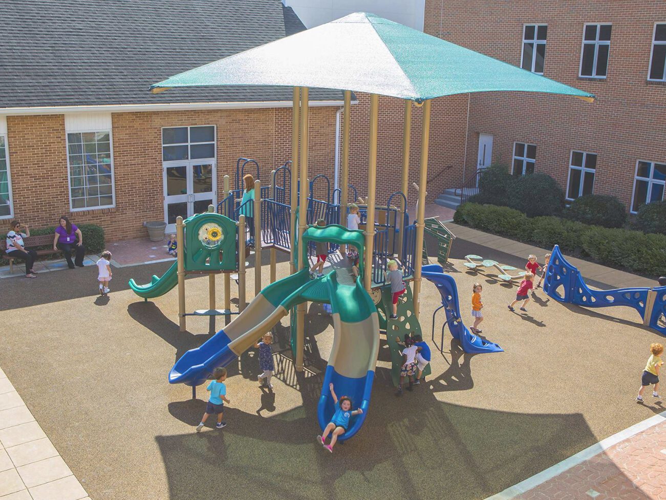 Schoolyard with children on play structures