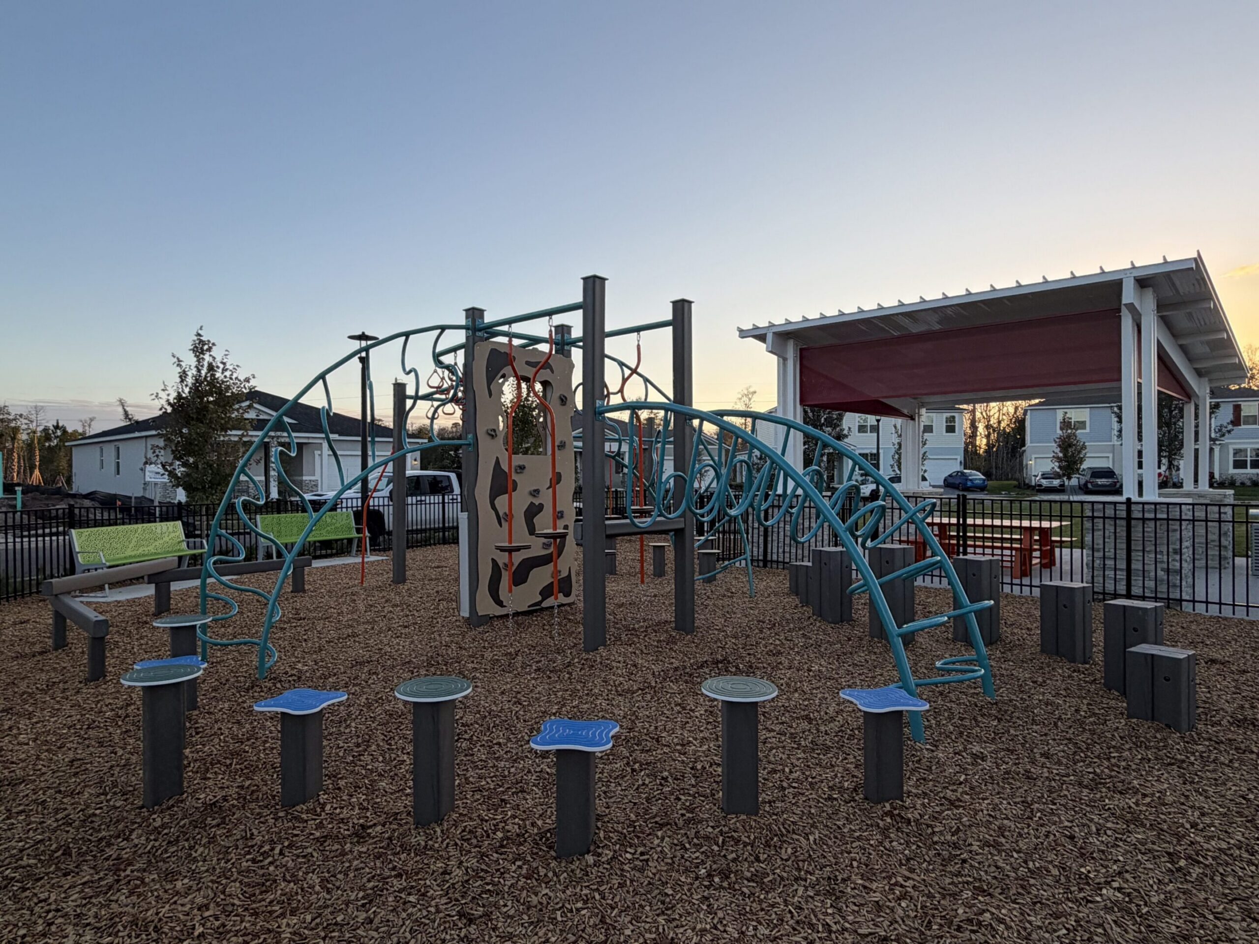 Playground with climbing structure at sunset