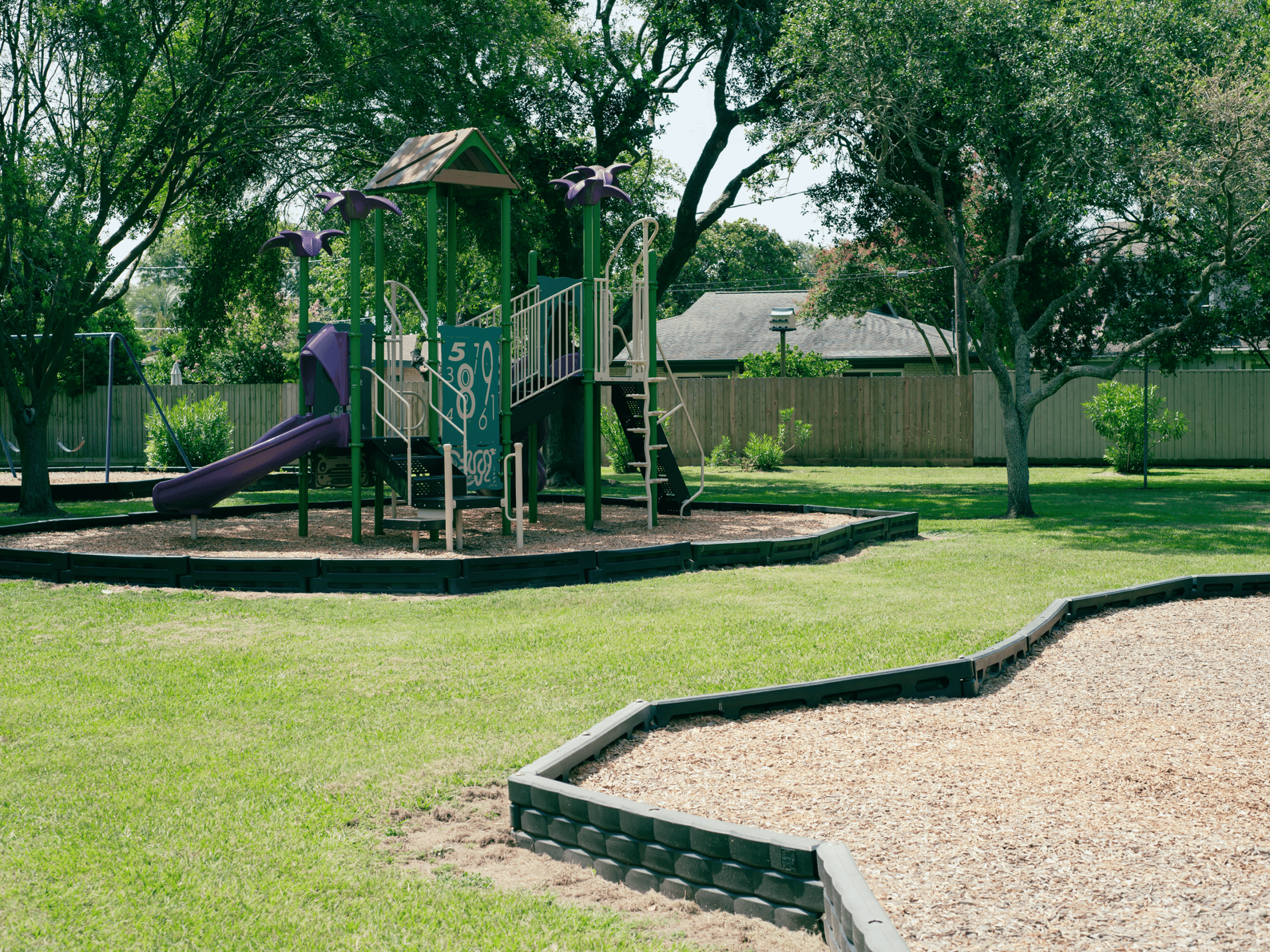 Playground with slide and climbing structure