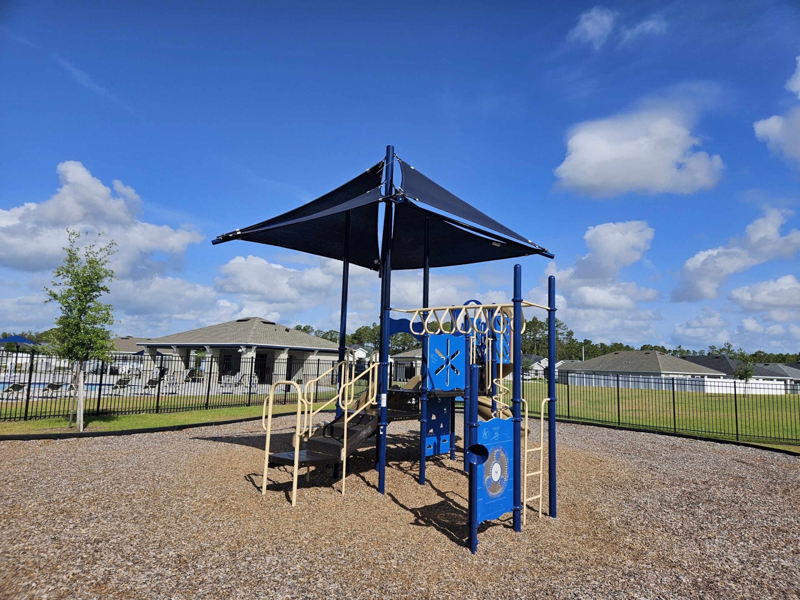 Playground with climbing structure under blue sky