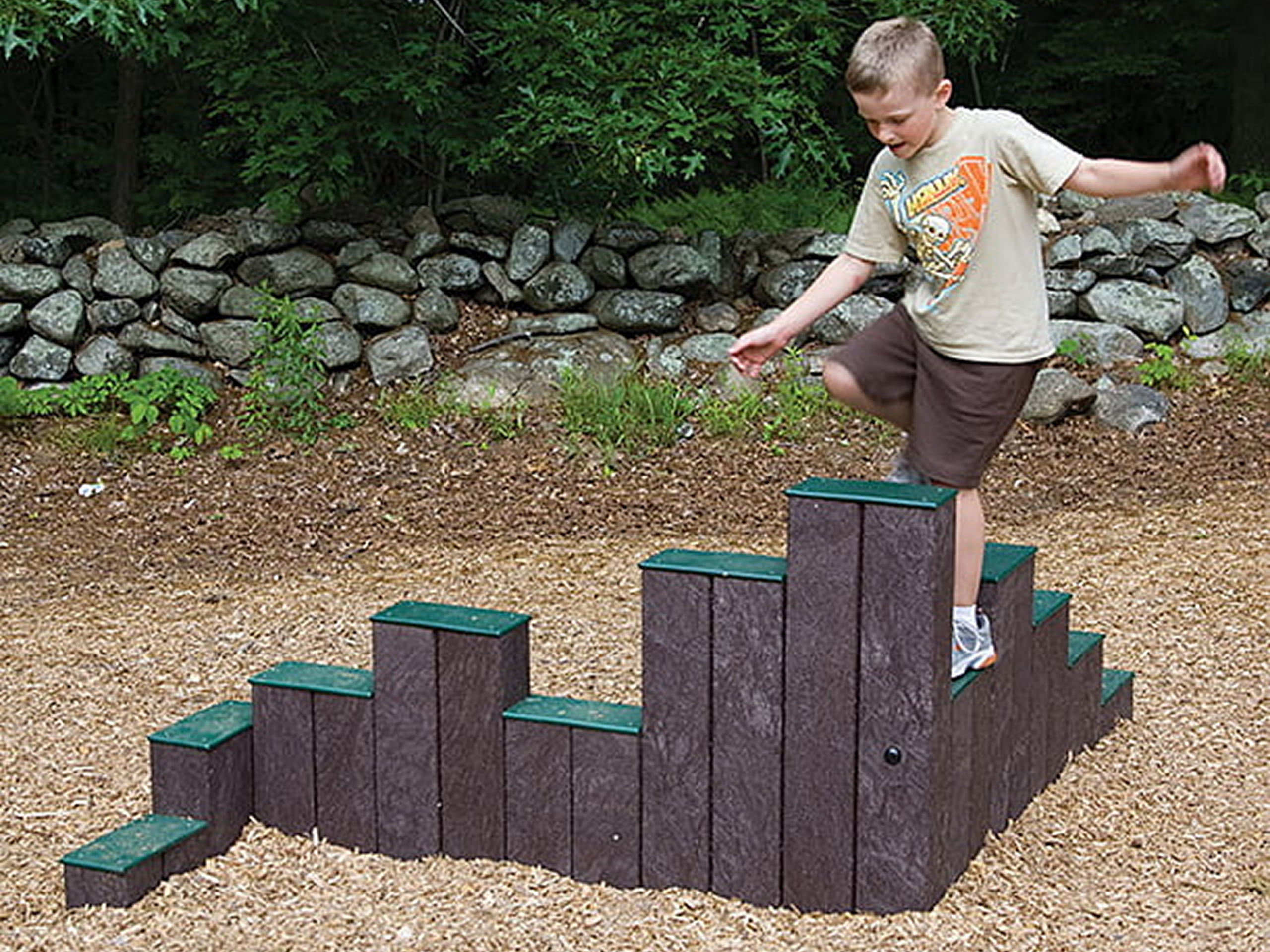 Child climbing outdoor playground steps