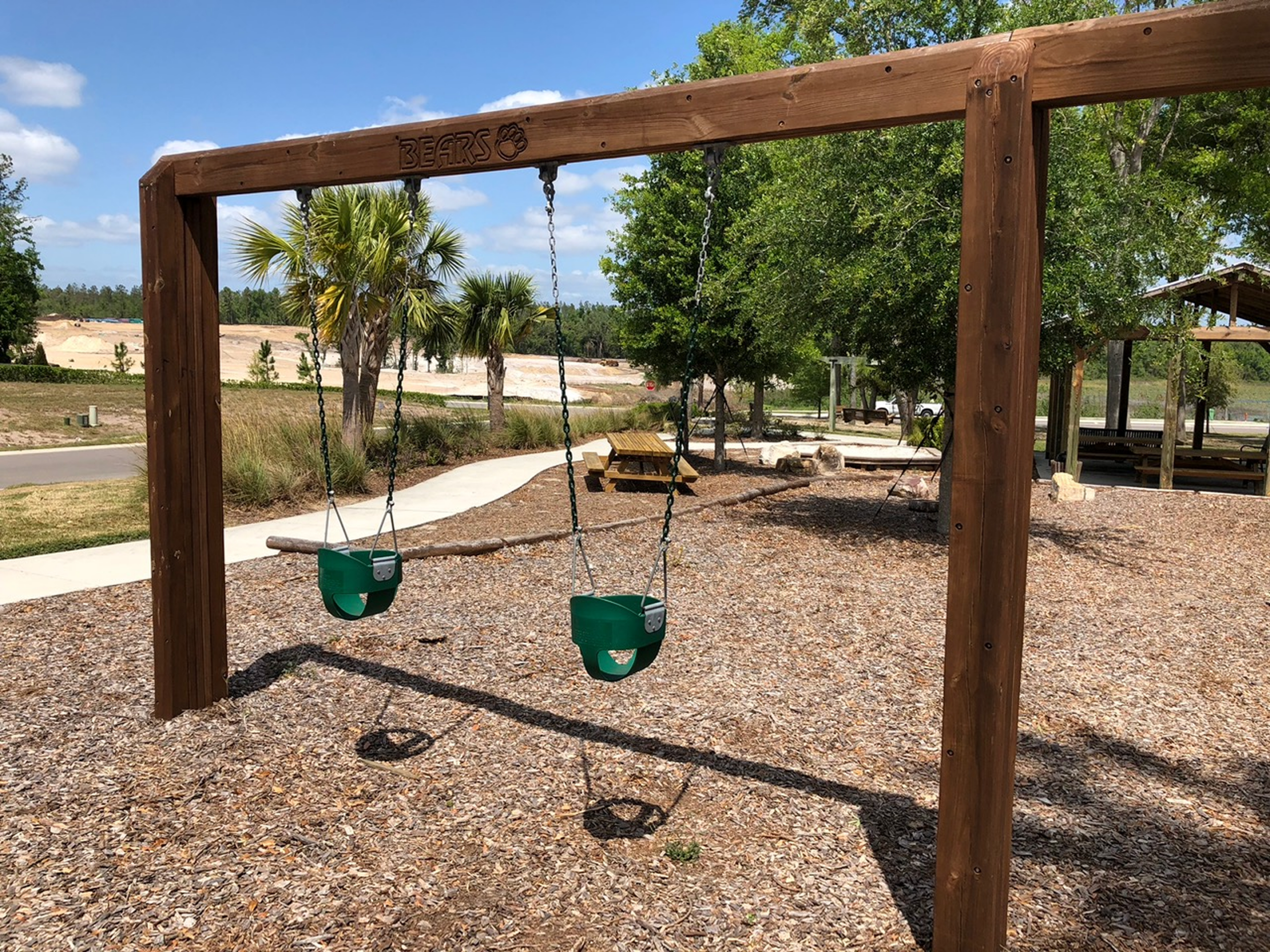 Empty swings in a sunny park