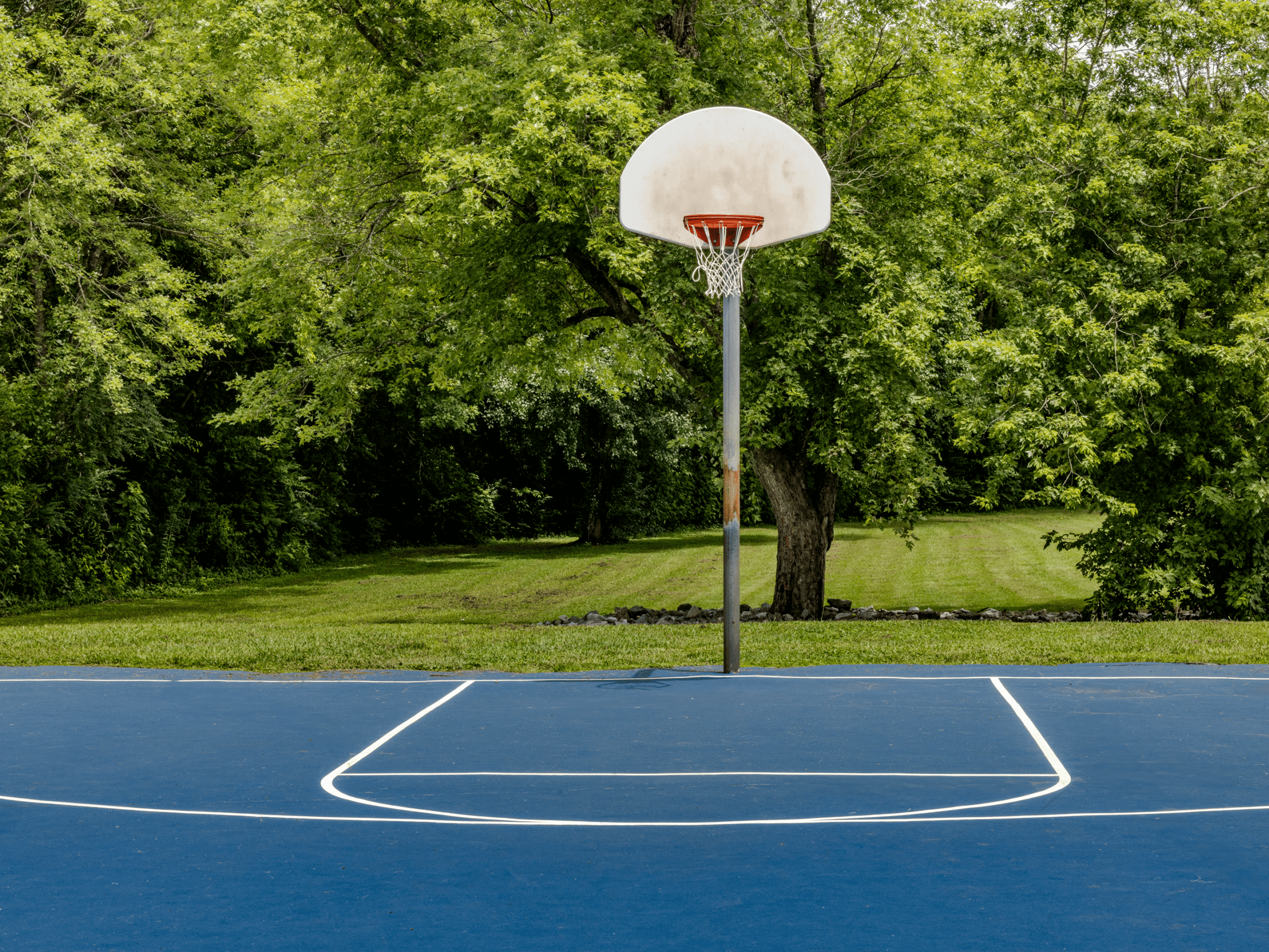 Basketball hoop on blue court