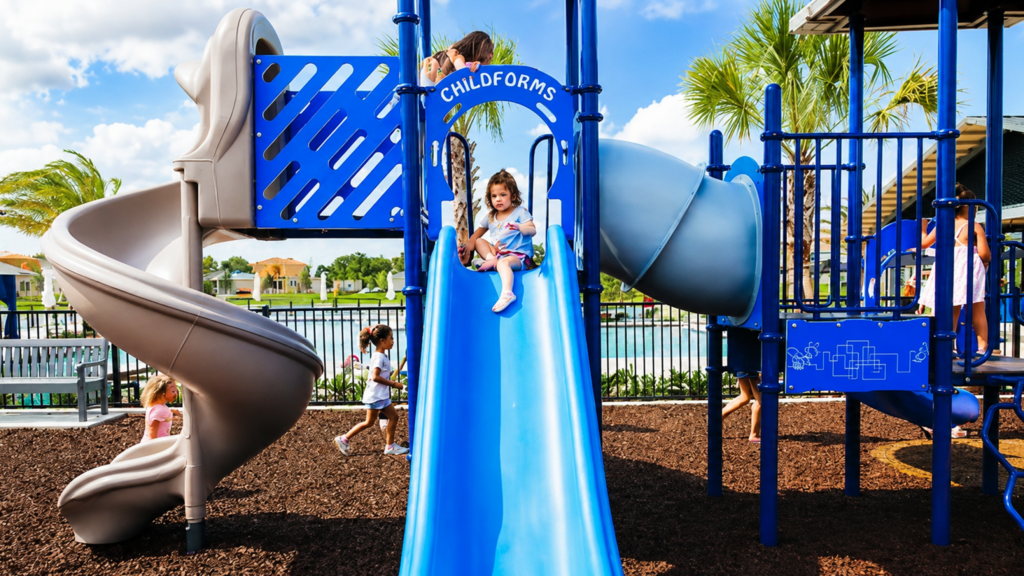 Children playing on colorful slides