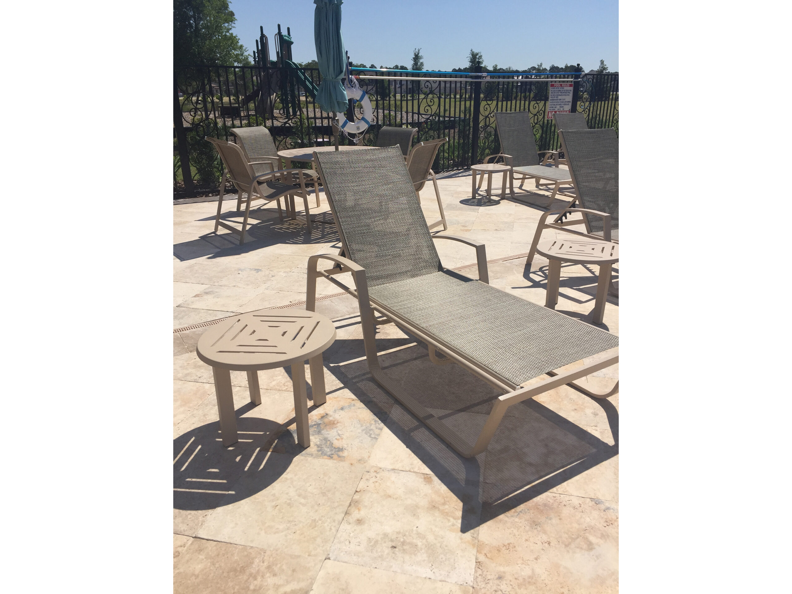 Poolside lounge chairs in the sun