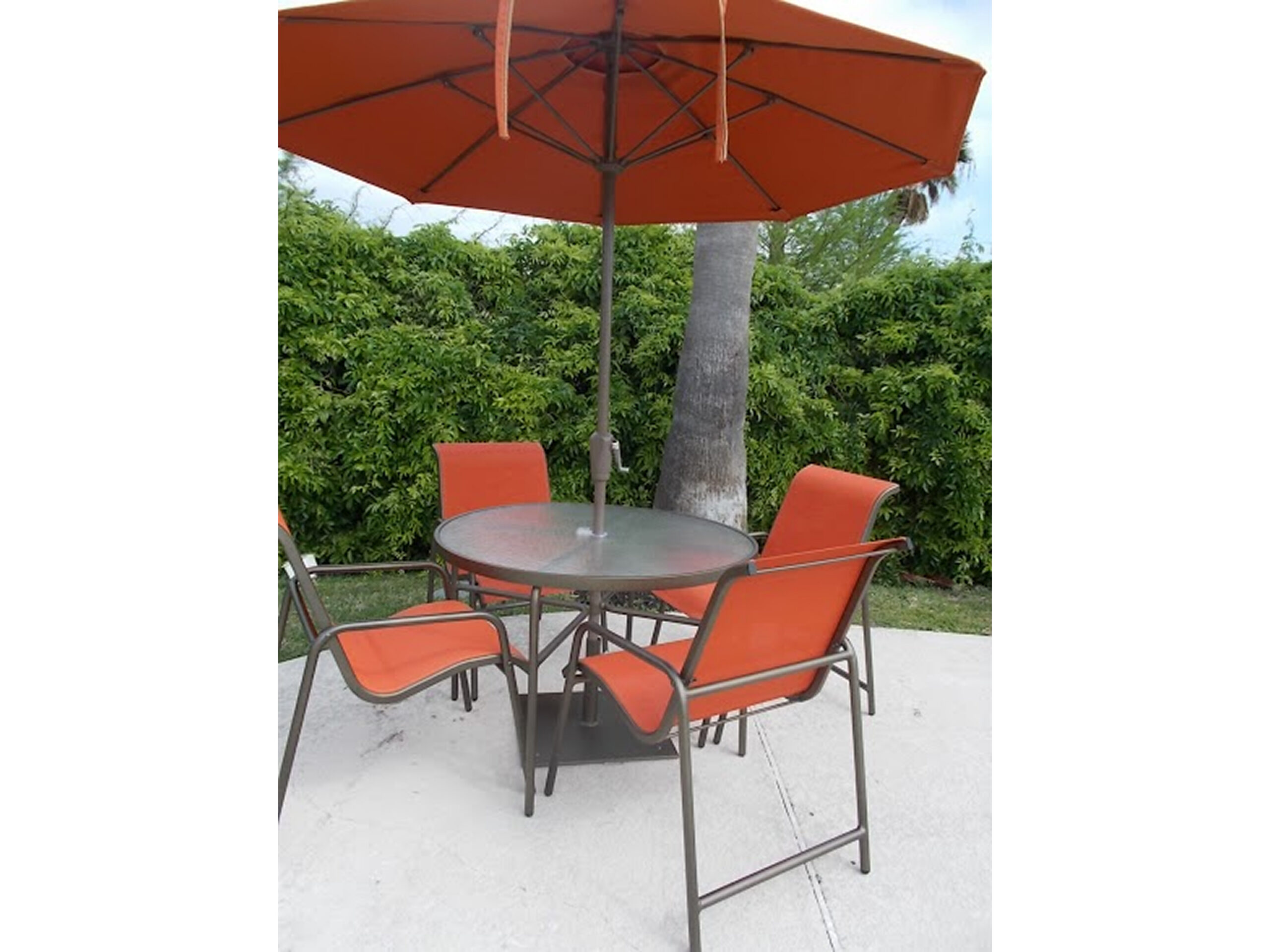 Outdoor patio set with orange umbrella