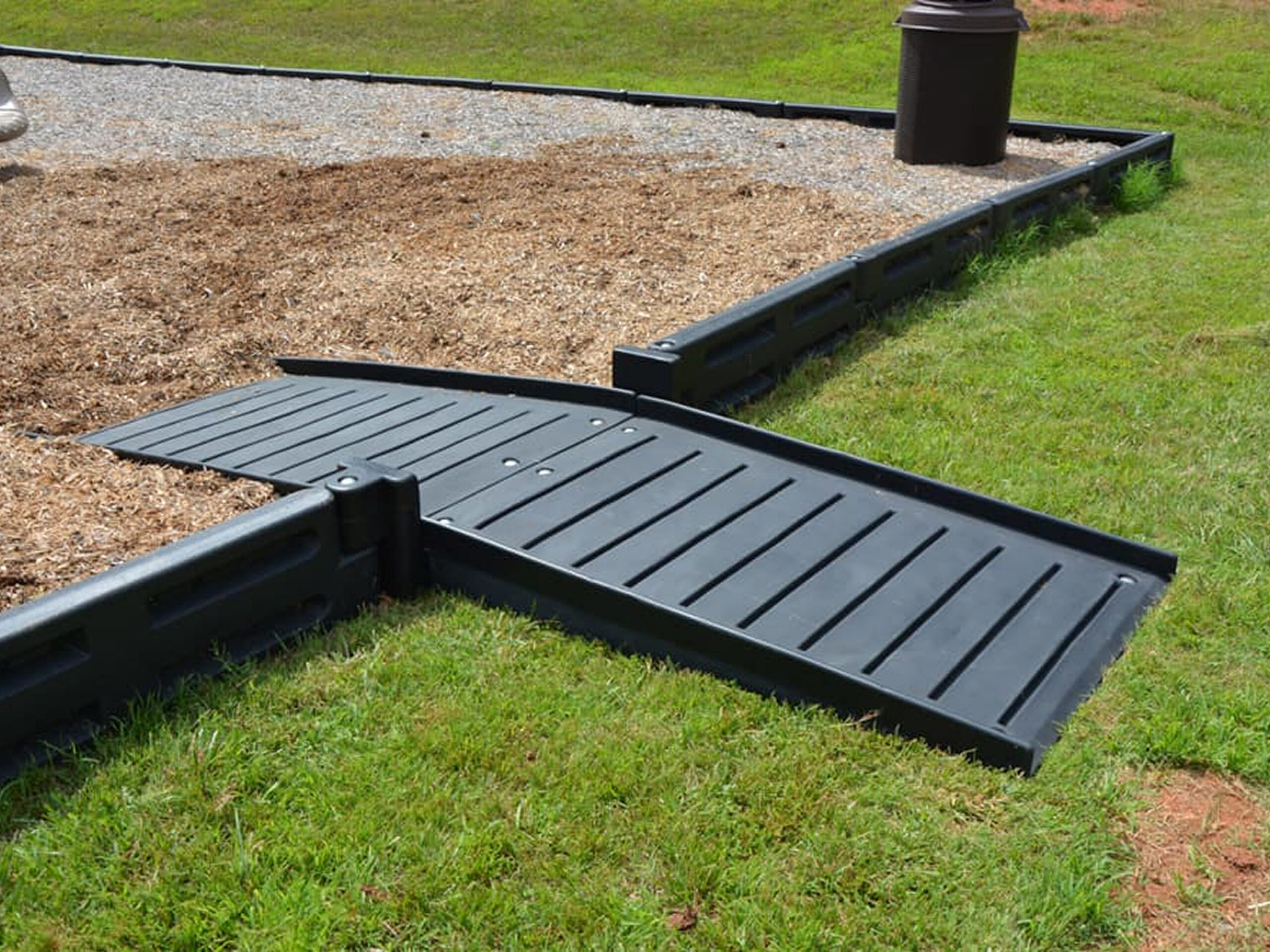 Playground accessibility ramp on grass