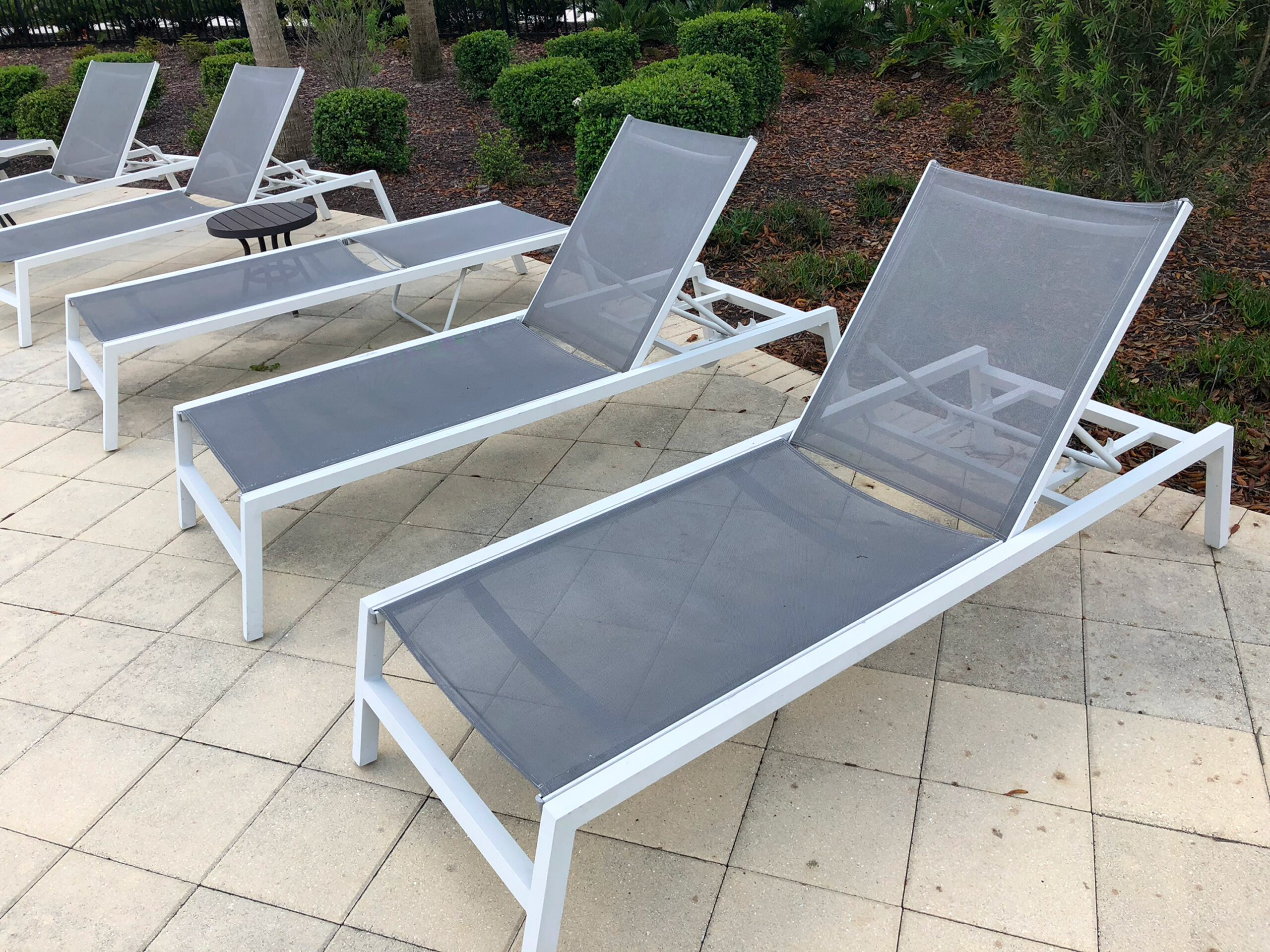 Outdoor patio with gray lounge chairs