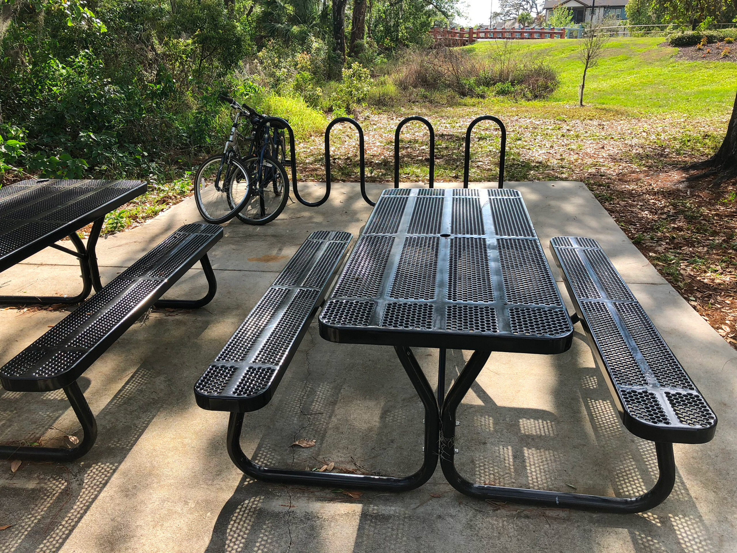 Picnic tables and bike rack in park