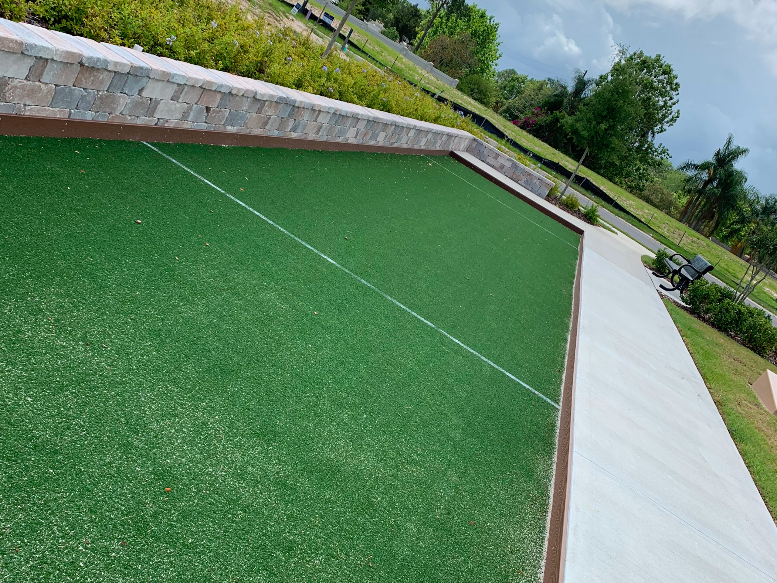 Bocce court surrounded by greenery
