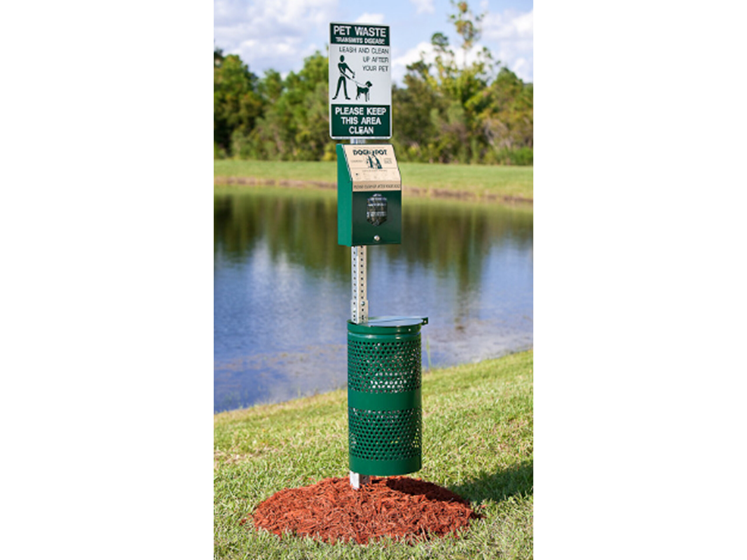 Green pet waste disposal station outdoors
