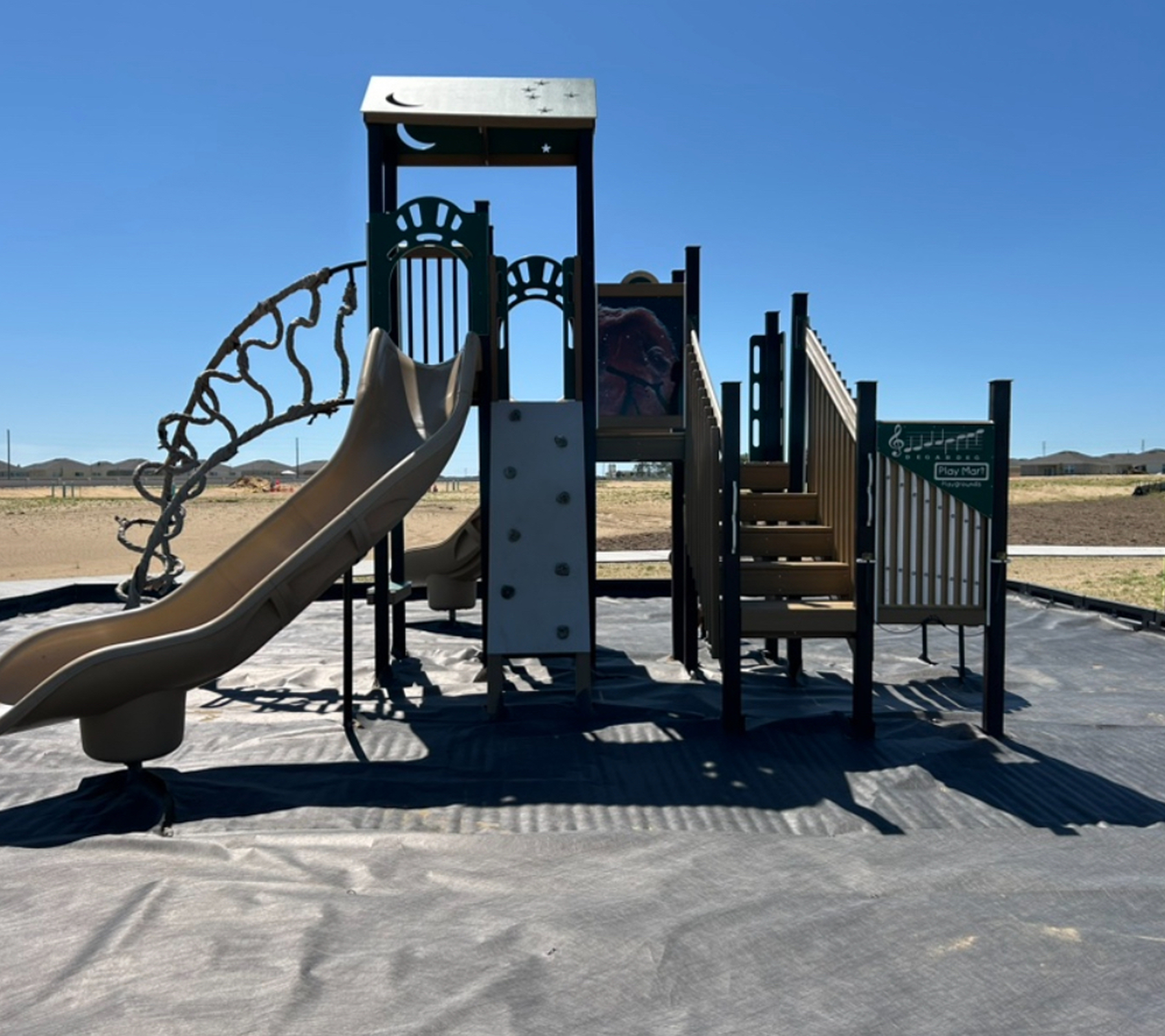 Children’s play equipment under blue sky