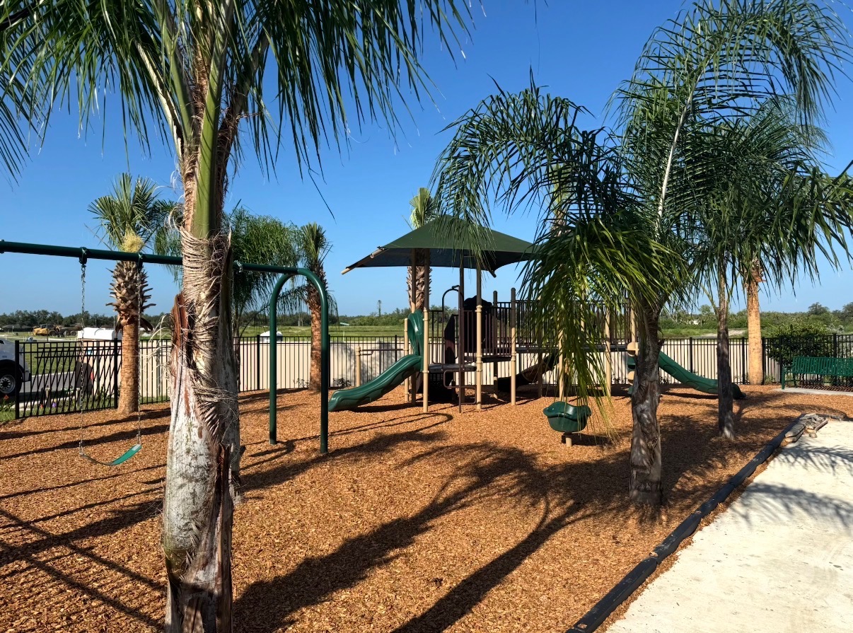 Children's play area with swings and slides