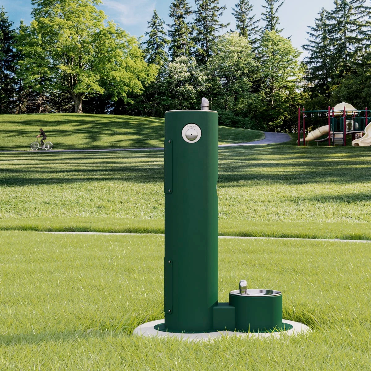 Park water fountain with trees and grass