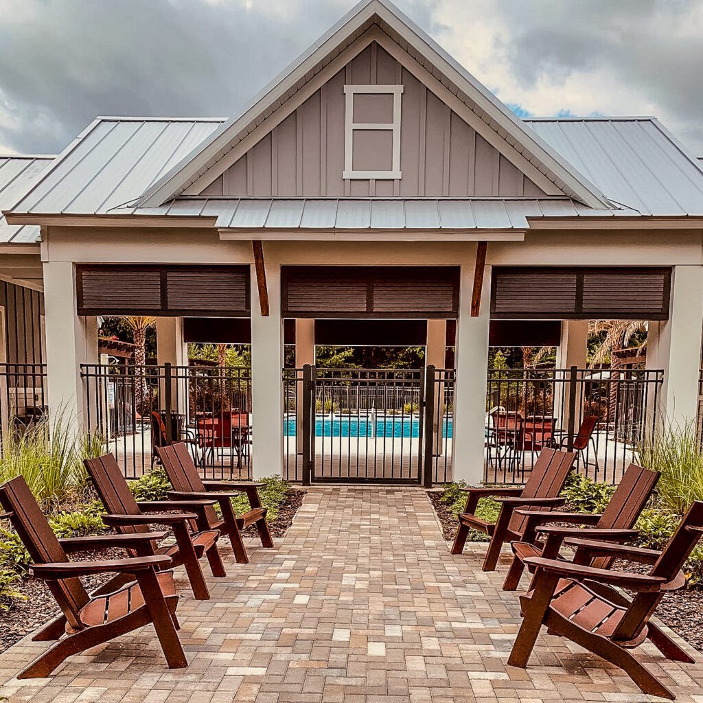 Outdoor seating by gated pool area