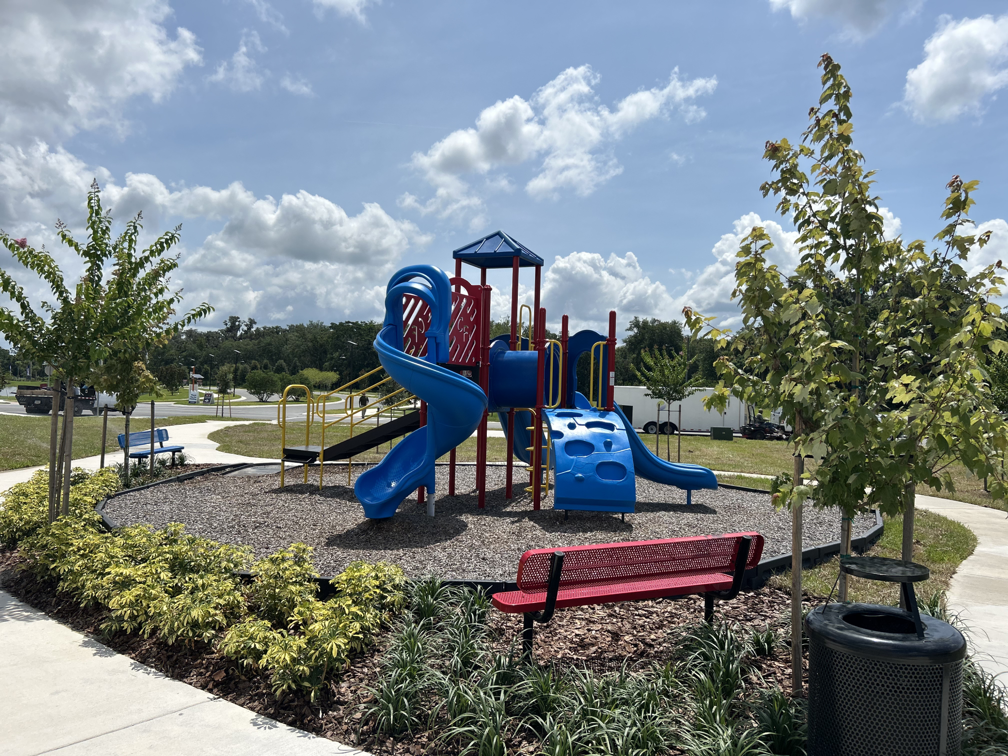 Playground with colorful slides and benches